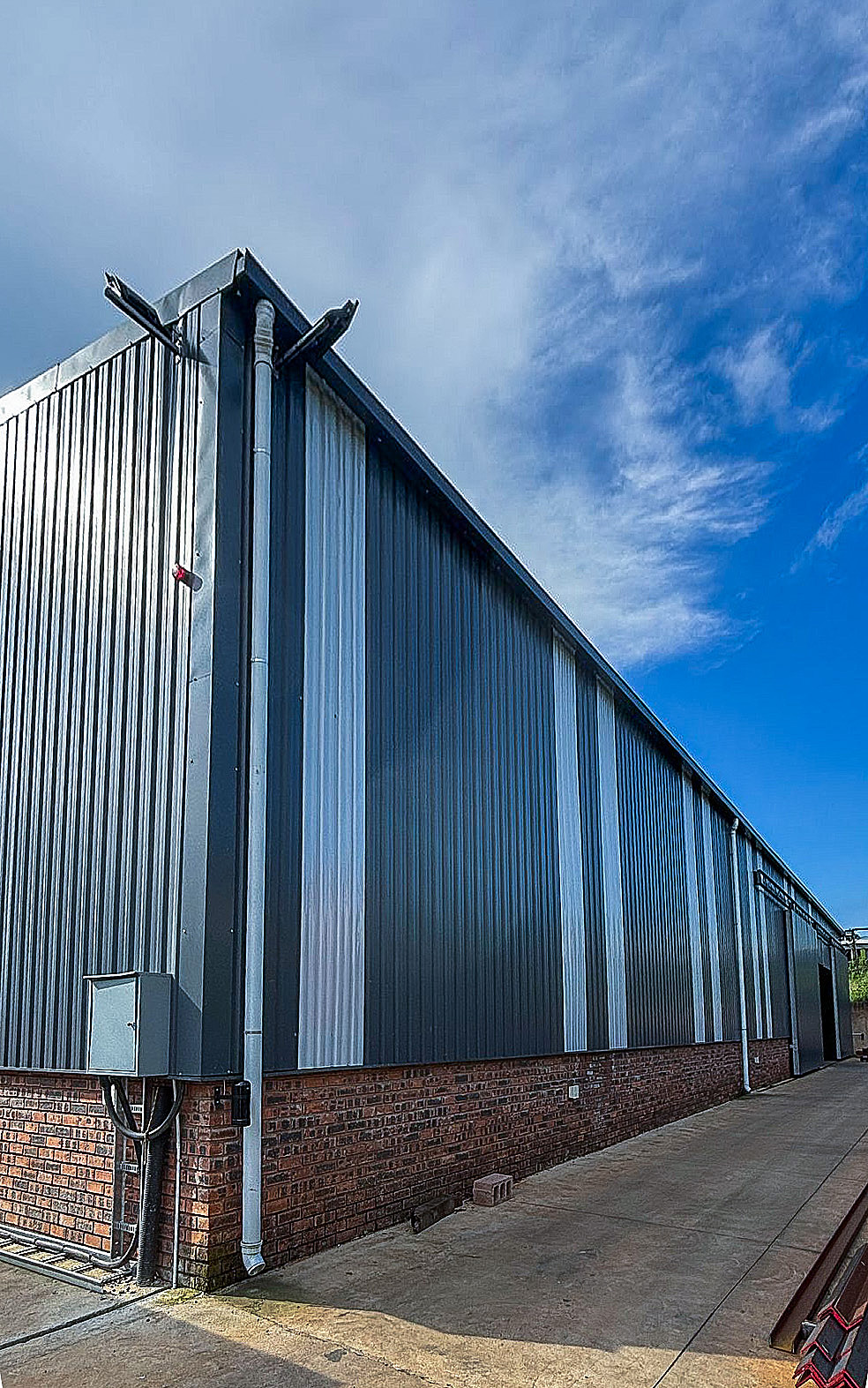 steel structure warehouse with translucent cladding sheets that allow natural light through